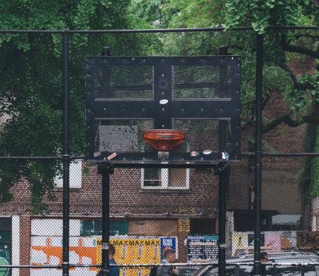 A basketball hoop in a city park.